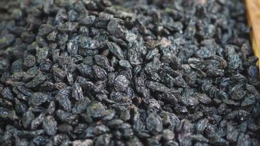 Pile of Raisins display for sale at local market .