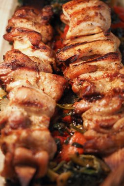 Tender grilled chicken skewers served with fresh, colorful vegetables.