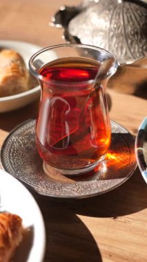 Enjoying traditional turkish tea and snacks on a sunny afternoon.