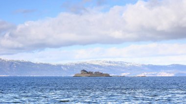 Munkholmen Island.  Munkholmen (Monk's Islet) is a small island located off the Norwegian city of Trondheim.  Benedictine monks built a monastery on the island in the early 11th century. clipart