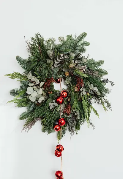 Fully decorated Christmas wreath on white background