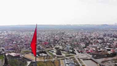 Top view historical famous Kars Castle and Kars city buildings, Eastern Anatolia Region Turkey on cloudy sky background