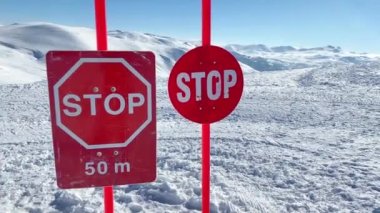 Avalanche danger sign posts in snowy mountains in Georgia. Goderdzi ski resort in high Adjara