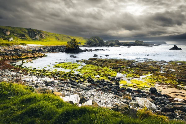 Wild dramatic northern Ireland coast in Ballintoy. Game of thrones filming locations concept.
