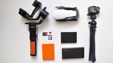 USA- 2021: Flatlay top view beginner photographer extra gear accessories set up background.Content creator, photographer, traveller and blogger extra gear carry on. Cut out outdated gear