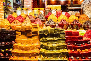 Piles of various colorful tasty candy sweets on bazaar for sale in iranian street market