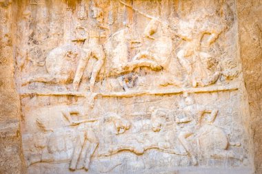 Nasqsh-e Rostam, Iran - 2022: Victory of Bahram II monument.Tombs of Artaxerxes I and Darius the Great, kings of the Achaemenid empire, located in the Naqsh-e Rostam necropolis