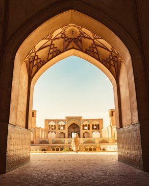 Kashan, Iran - 29th may, 2022: Tourists and pilgrims explore sightseeing beautiful Agha Bozorg Mosque