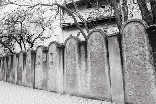 Krakow, Poland - march 7, 2023: Fragment of the wall of Jewish Ghetto in Krakow, Poland. Ghetto Walls were built in style of Jewish graves symbolizing destiny of enslaved people.