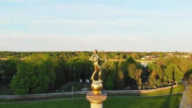 Siauliai, Lithuania - 2nd June, 2021: Aerial view statue of Golden boy in Siauliai, Lithuania, Europe travel destination.
