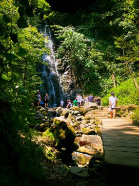 Mirveti, Georgia - 6th august, 2022: tourist by famous travel destination Mirveti waterfall