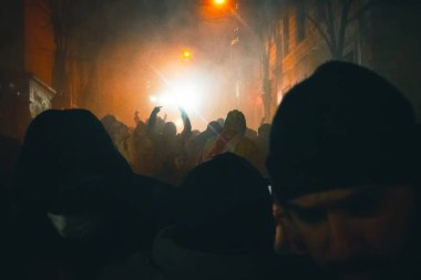 Tbilisi, Georgia - 1st december, 2024: Protesters georgians by parliament protest and stand for EU. European Union manifestation. Protests against Government.Security spray water on demonstrators clipart