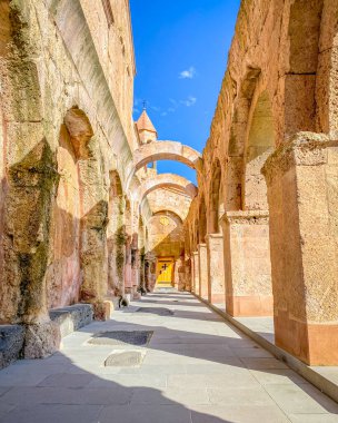 Arched columns and old brick wall of Odzun Church. Armenian basilica constructed around the 5th 7th century in the Odzun village of the Lori Province of Armenia. clipart