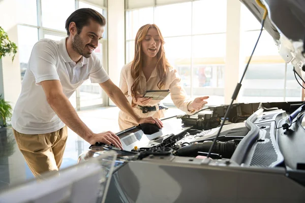 Smiling Man Looking Parts Car Hood Assisted Sales Consultant — Stock Photo, Image