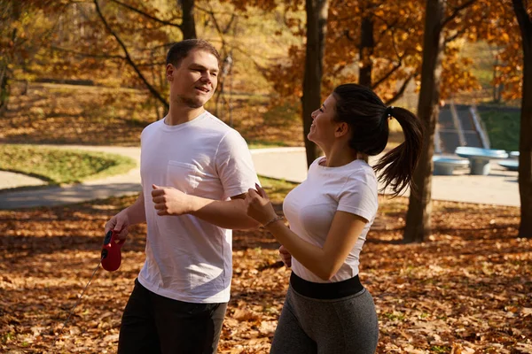 Handsome Guy His Young Girlfriend Jogging Park Hands Man Roulette — Stock Photo, Image