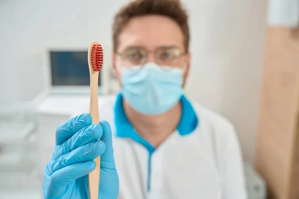 Blurred Portrait Dental Hygienist Face Mask Nitrile Glove Holding Toothbrush — Stock Photo, Image