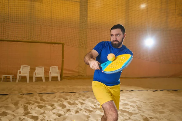 Focused Tennis Player Sportswear Catching Tennis Ball Air Racket While — Zdjęcie stockowe
