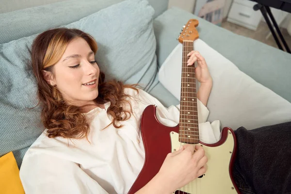 Smiling Pleased Young Female Songwriter Involved Playing Acoustic Guitar Bed — Fotografia de Stock