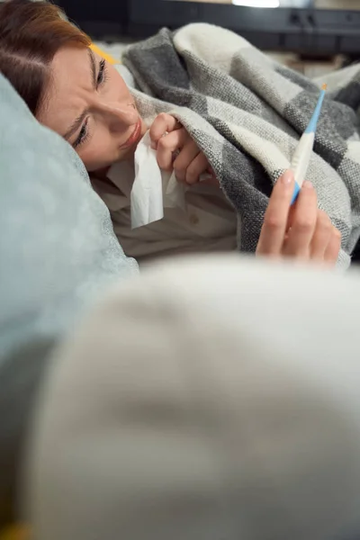 Sick Worried Female Holding Handkerchief Looking Digital Thermometer Hand — Foto de Stock