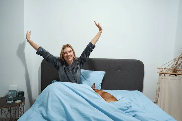 Smiling Young Woman Wrapped Duvet Stretching Cozy Bed While Her — Stock Photo, Image