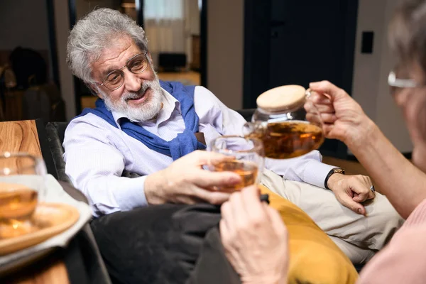 Elderly Male Woman Sitting Sofa Hotel Man Holding Cup Lady — Stockfoto