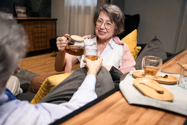 Elderly Male Woman Sitting Sofa Hotel Man Holding Cup Female — Stockfoto