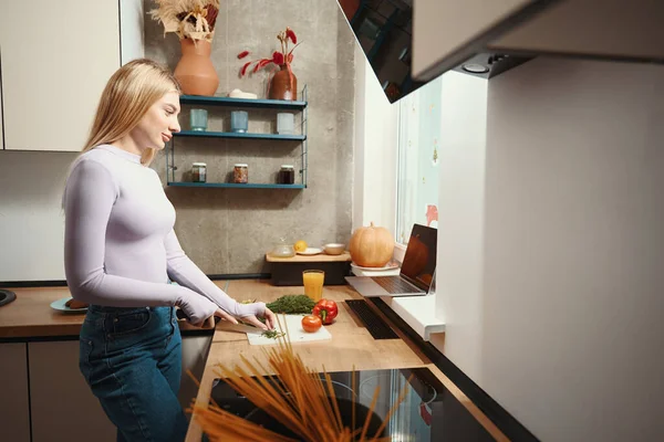 Side View Dreamy Housewife Chopping Dill Cutting Board Kitchen — Φωτογραφία Αρχείου