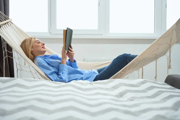 Side View Relaxed Young Woman Book Lying Hammock Indoors — Stockfoto