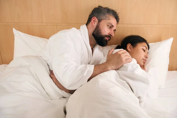 Caring Young Male Lying Bed While Touching His Depressed Girlfriend — Stock Photo, Image