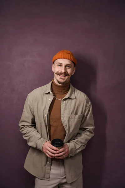 Smiling Pleased Stylish Young Man Paper Cup Hands Standing Wall — Stock Photo, Image