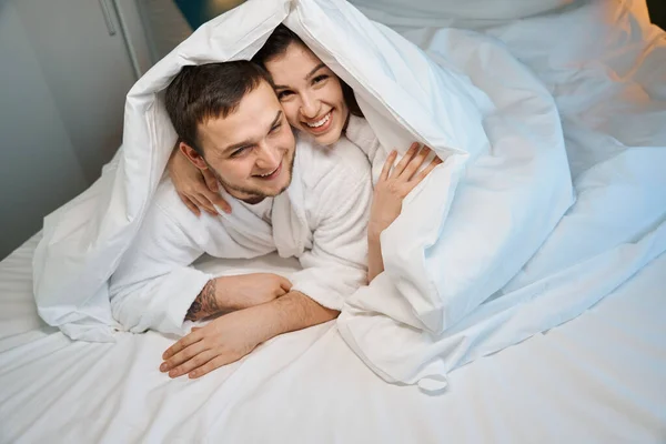Cheerful Young Couple Frolics Large Bed Guys Built Hut Blanket — Stock Photo, Image