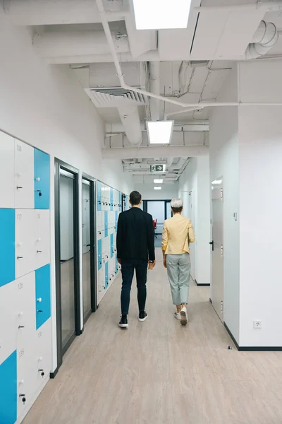 Colleagues Walking Bright Illuminated Hall Storage Cells Office Coworking Space — Stock Photo, Image