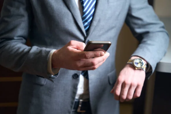 Man Business Suit Holds Mobile Phone His Hands Male Has — Stock Photo, Image
