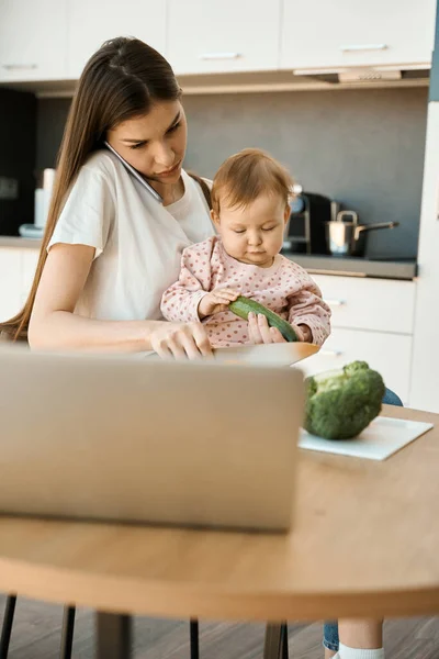 Serious Young Woman Preparing Food Working Home Babysitting Child Female — Stock Photo, Image