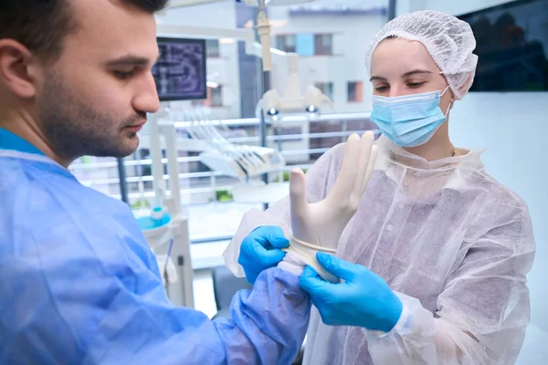 Woman Assistant Puts Doctor Disposable Sterile Gloves Team Preparing Operation — Stock Photo, Image