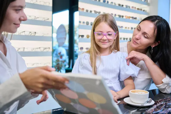 Pleased Child Looking Set Tinted Eyeglass Lenses Presence Her Mother — Stock Photo, Image