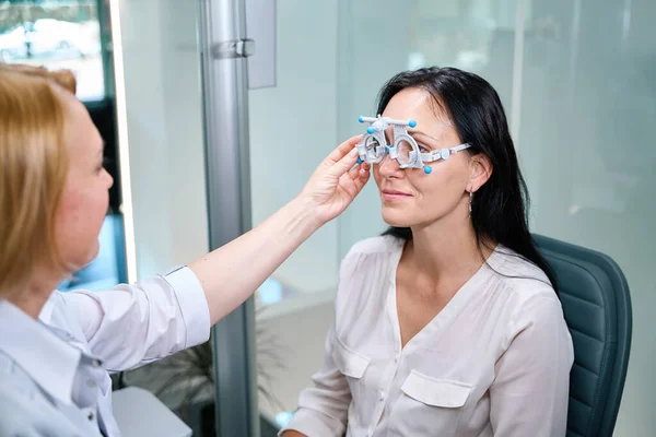 Eye Doctor Putting Trial Lens Frame Face Adult Female Patient — Stock Photo, Image