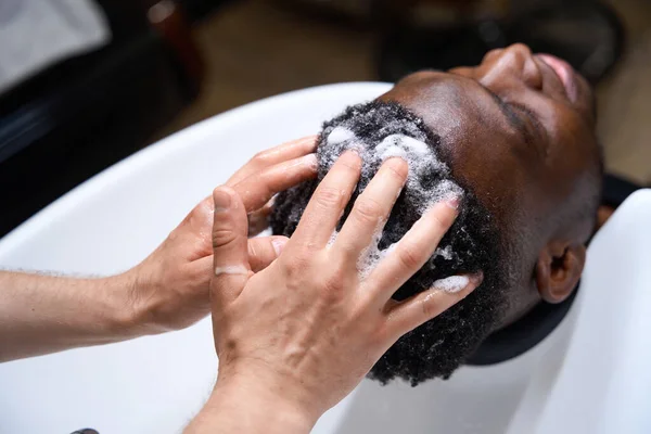 Barber Washes Clients Hair Special Shampoo African American Male Has — Stock Photo, Image