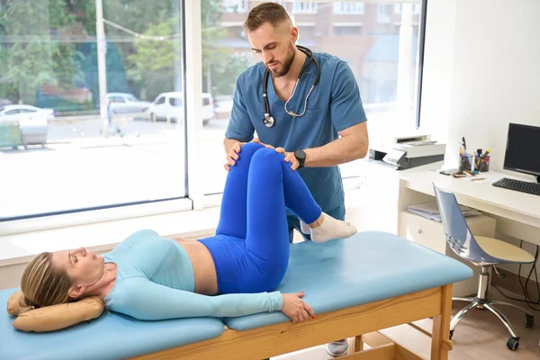 Man Orthopedist Checking Female Patient Joints Kneecaps Doing Professional Rehabilitation — Stock Photo, Image