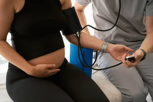 Man Uniform Measures Blood Pressure Pregnant Woman Specialist Uses Tonometer — Stock Photo, Image