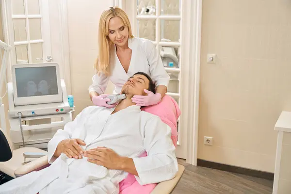 Blonde Woman Performs Microneedle Lifting Client Chin Area Man Sits — Stock Photo, Image