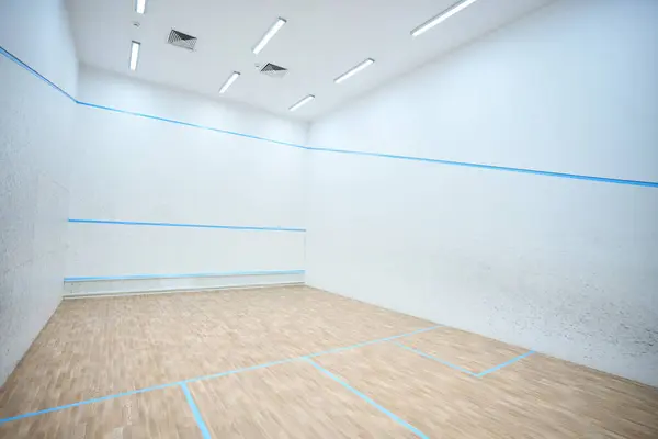 Modern indoor squash court interior in white colors copy space for advertising content