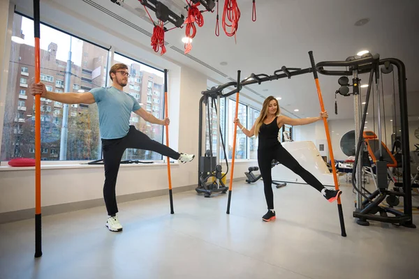 Effective physical exercises for balance in a rehabilitation center, using special sports sticks