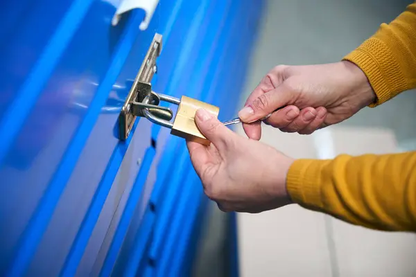 Woman Uses Keys Open Lock Door Storage Room — Stock Photo, Image
