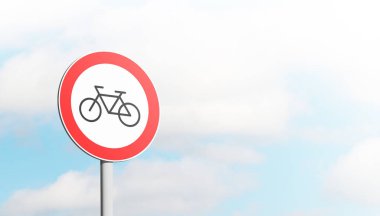 Round bicycle sign transit prohibited for bicycles on a blue sky background. Bicycle road sign, prohibition red sign. 3D illustration.