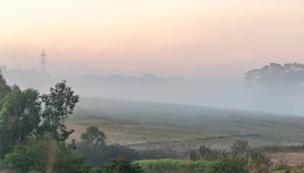 winter dawn with fog formation. Rural landscape at dawn. Winter morning in south america.