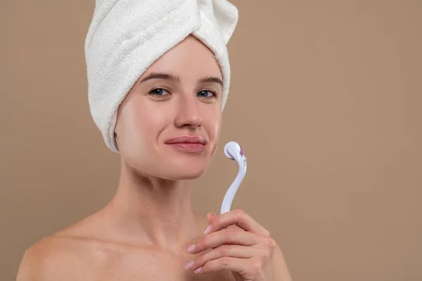 Face Massage Girl Holding Face Roller Looking Contented — Stock Photo, Image