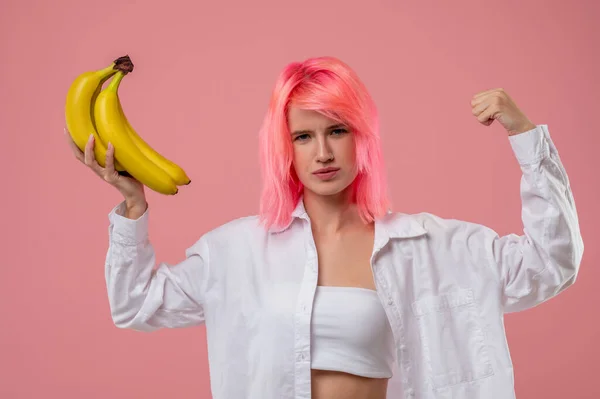 Waist Portrait Pink Haired Pretty Girl Bunch Yellow Bananas Flexing — Stock Photo, Image