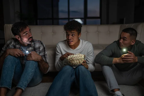 Scared Guy Bowl Popcorn Sitting Floor Surrounded His Pals Turned — Stock Photo, Image