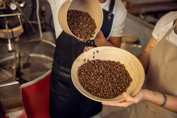 Cropped Photo Roast Master Pouring Roasted Coffee Beans Jug Bowl — Stock Photo, Image